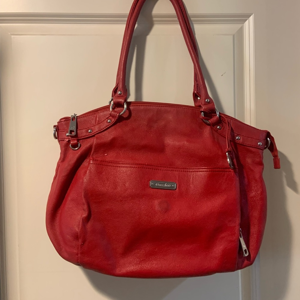 Grace Adele brand. High quality. Tons of pockets. Some wear.